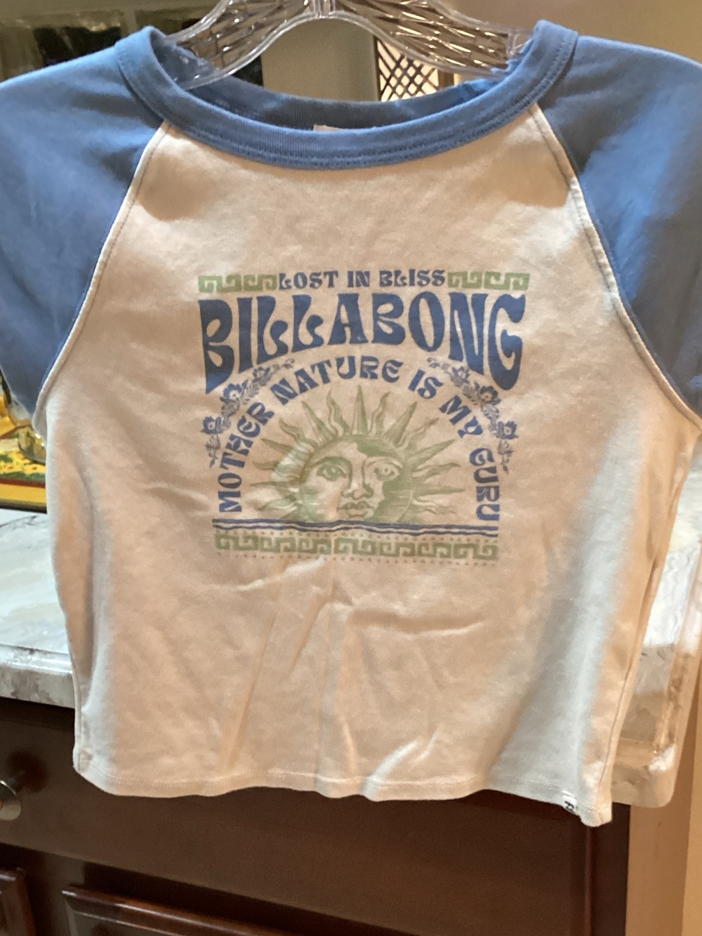 Billabong White Tee with Light Blue Raglan Sleeves and Green Sun Graphic
